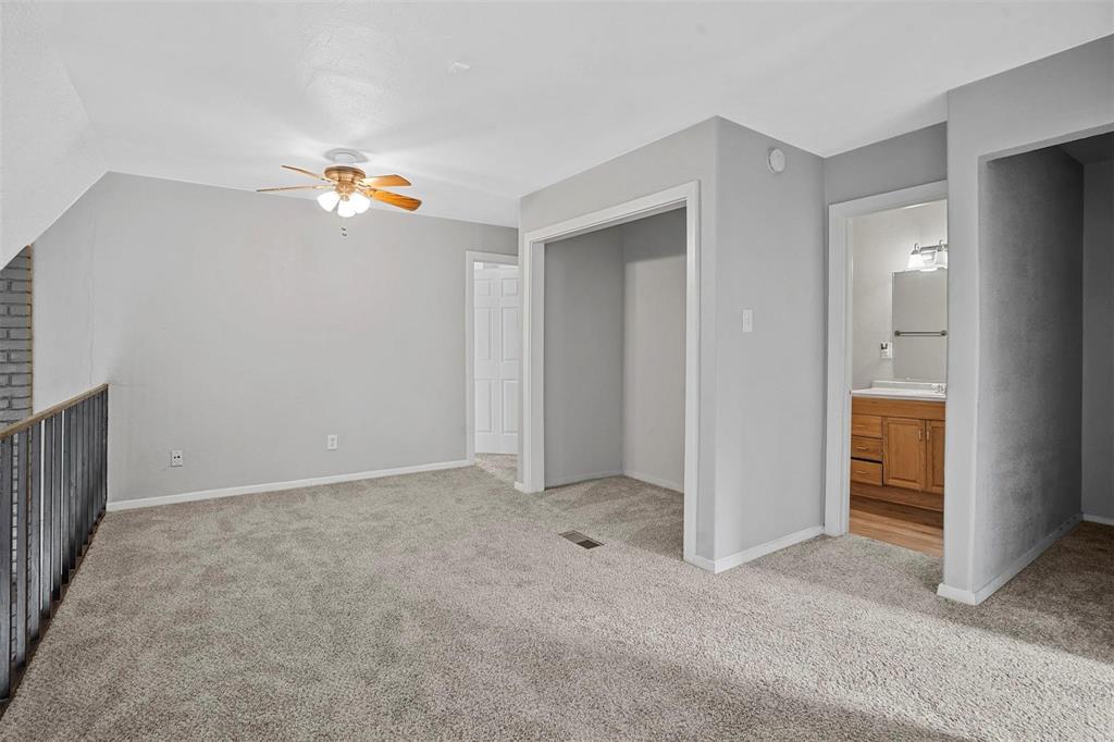 2156 Fleur De Lis Court Arlington, TX 76012 - Photo 10 of 16 an empty room with a kitchen and a sink