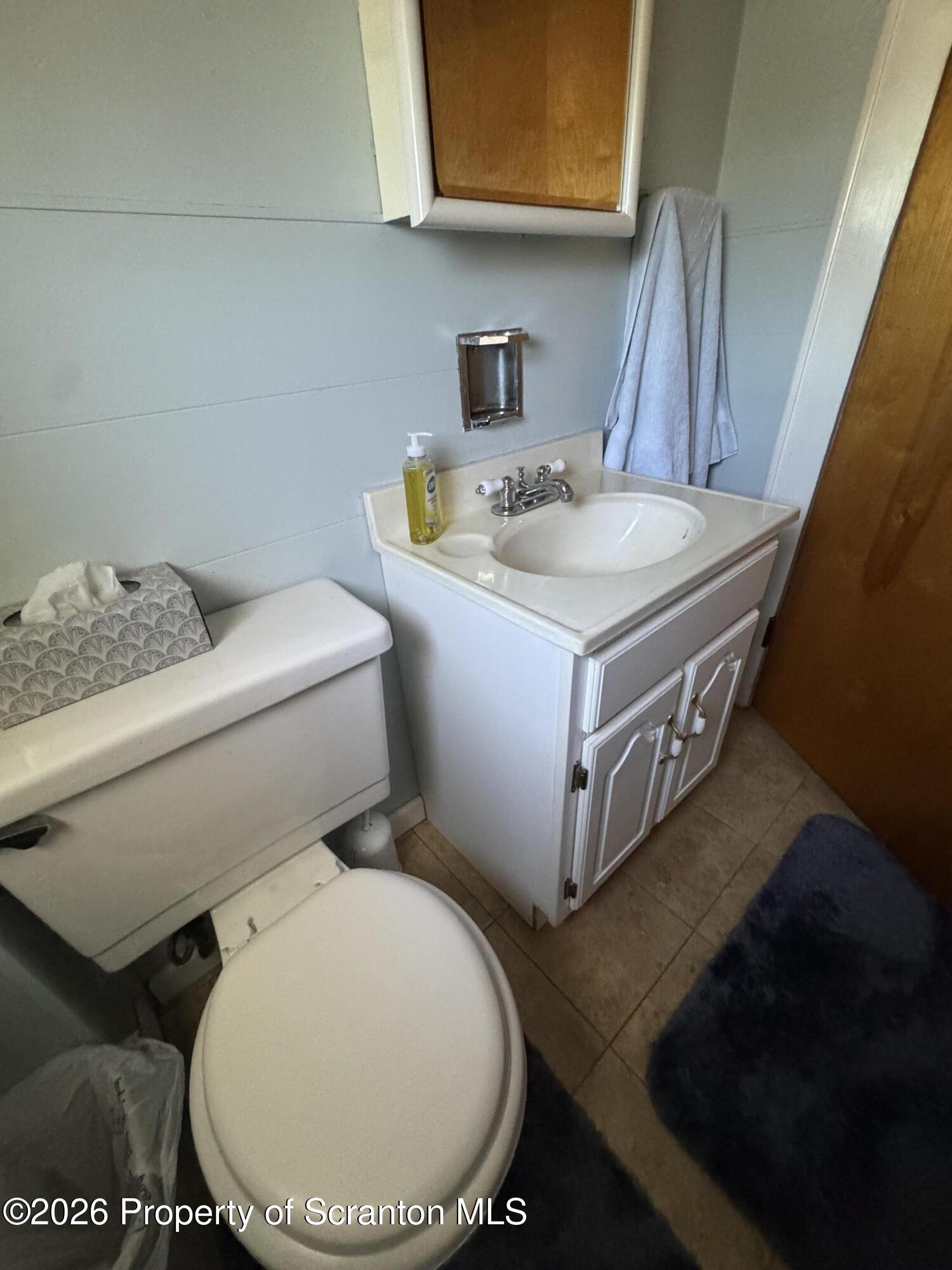 409 East Warren Street Dunmore, PA 18512 - Photo 15 of 19 a bathroom with a sink and a toilet