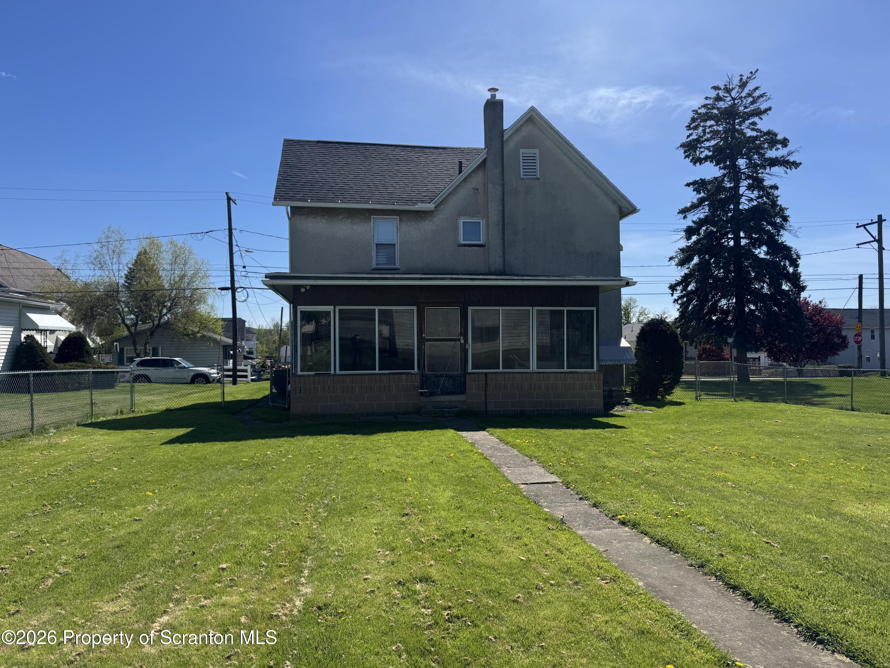409 East Warren Street Dunmore, PA 18512 - Photo 18 of 19 a view of a house with a garden and yard