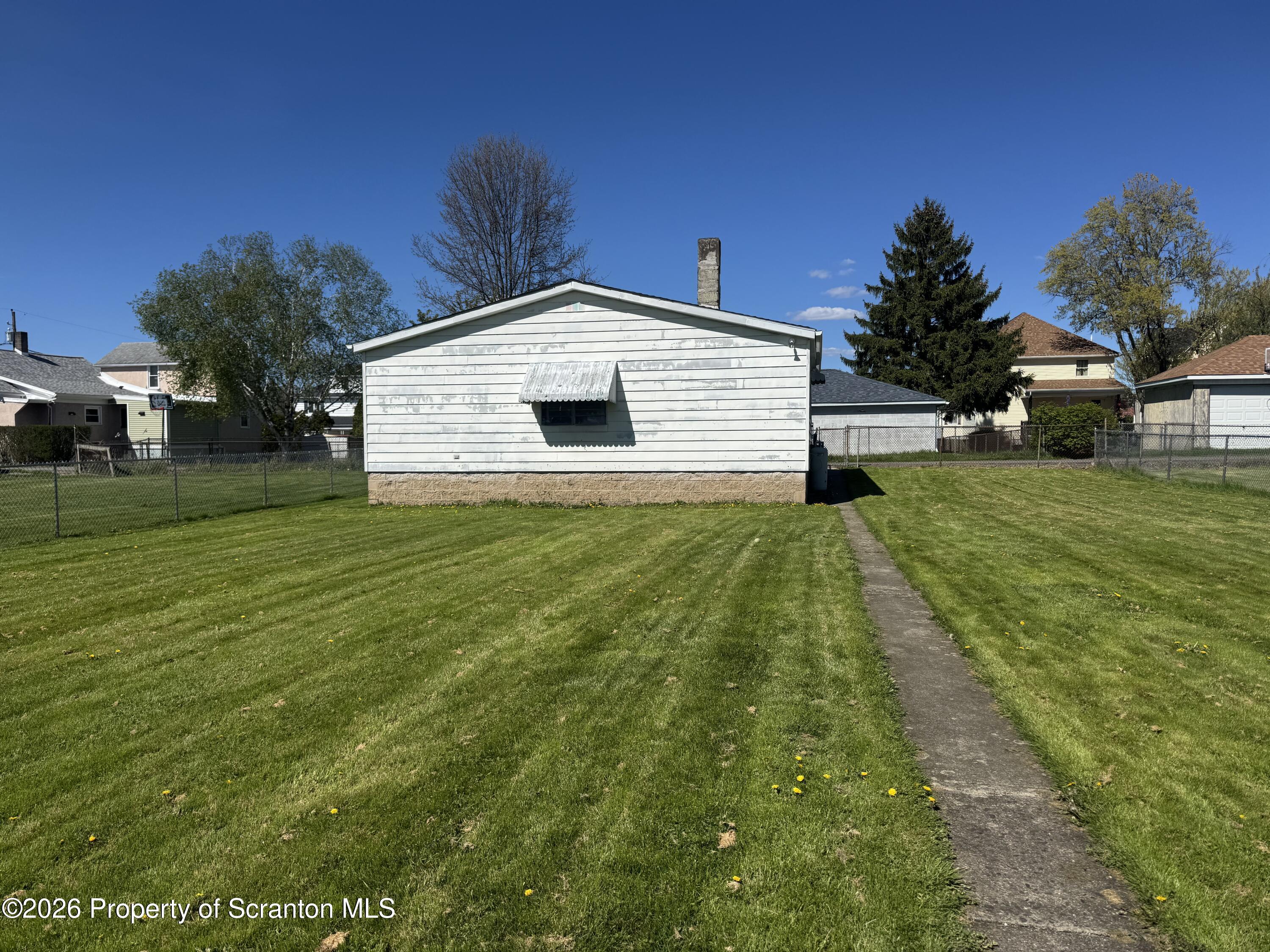 409 East Warren Street Dunmore, PA 18512 - Photo 19 of 19 a front view of a house with a yard