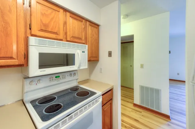 a kitchen with a stove and a microwave