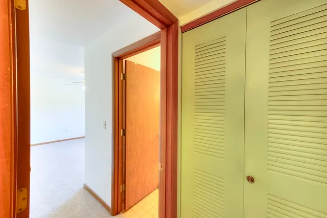 a view of a bathroom from a door