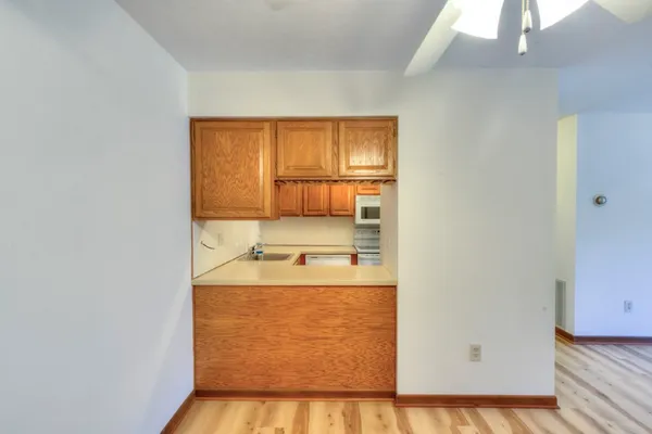 a view of a kitchen with a sink