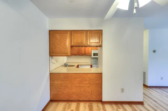 a view of a kitchen with a sink