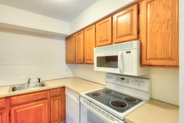 a utility room with sink washer and dryer