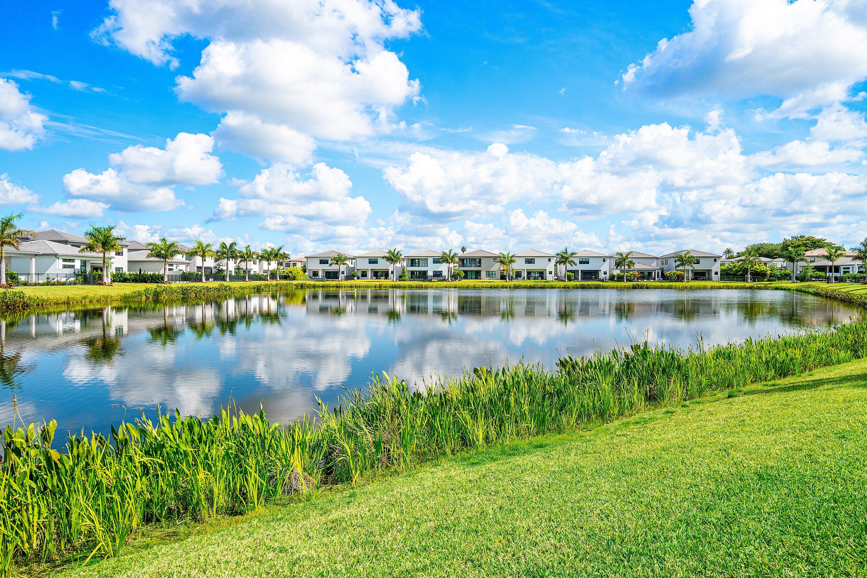 8233 Crystal Downs Avenue Boca Raton, FL 33434 - Photo 57 of 58 a view of a lake with houses in the back