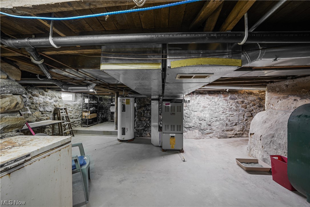 7541 Cooley Road Ravenna, OH 44266 - Photo 29 of 32 Basement with electric water heater and heating utilities