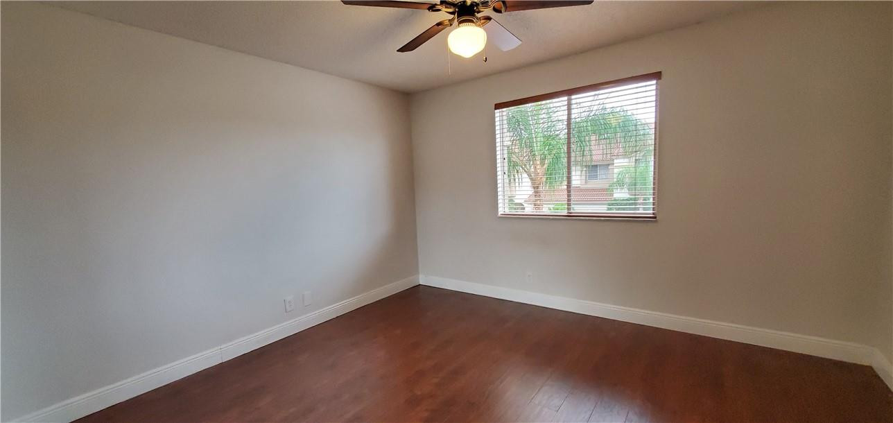 6823 Via Regina Boca Raton, FL 33433 - Photo 17 of 26 an empty room with a window