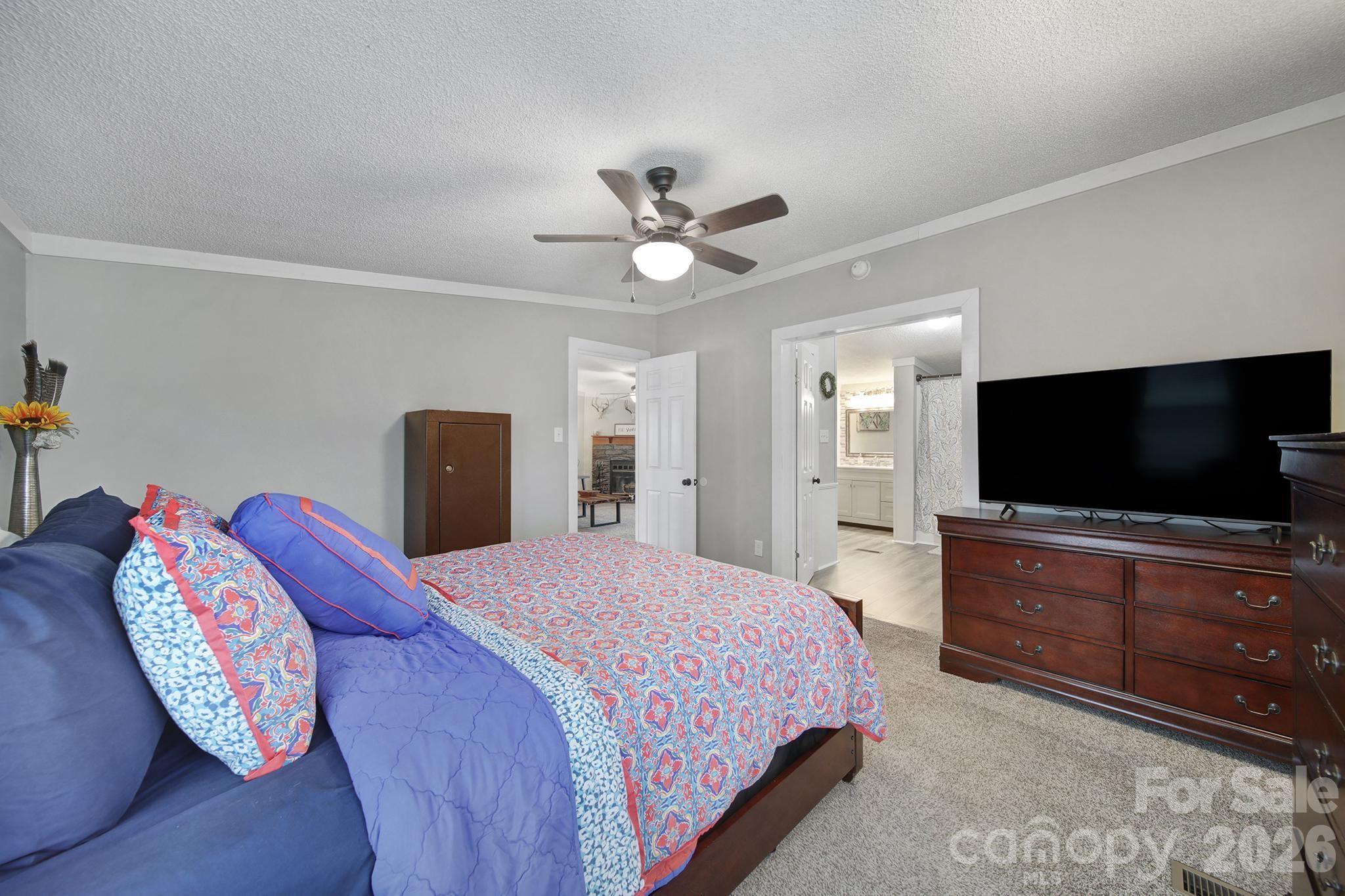 3840 Sherer Road Sharon, SC 29742 - Photo 17 of 30 a bedroom with a bed and a flat screen tv