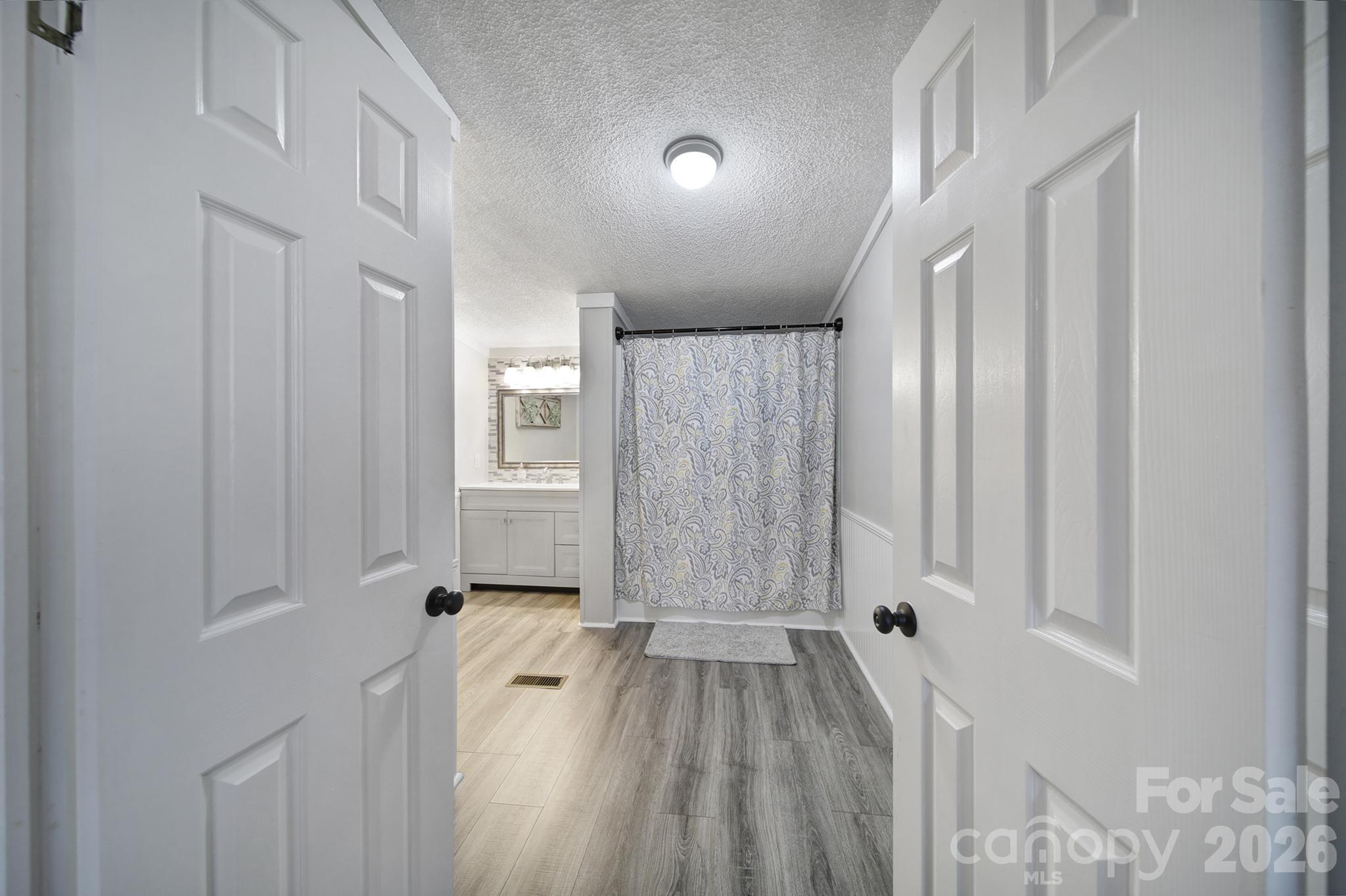 3840 Sherer Road Sharon, SC 29742 - Photo 19 of 30 a view of a hallway with wooden floor and staircase