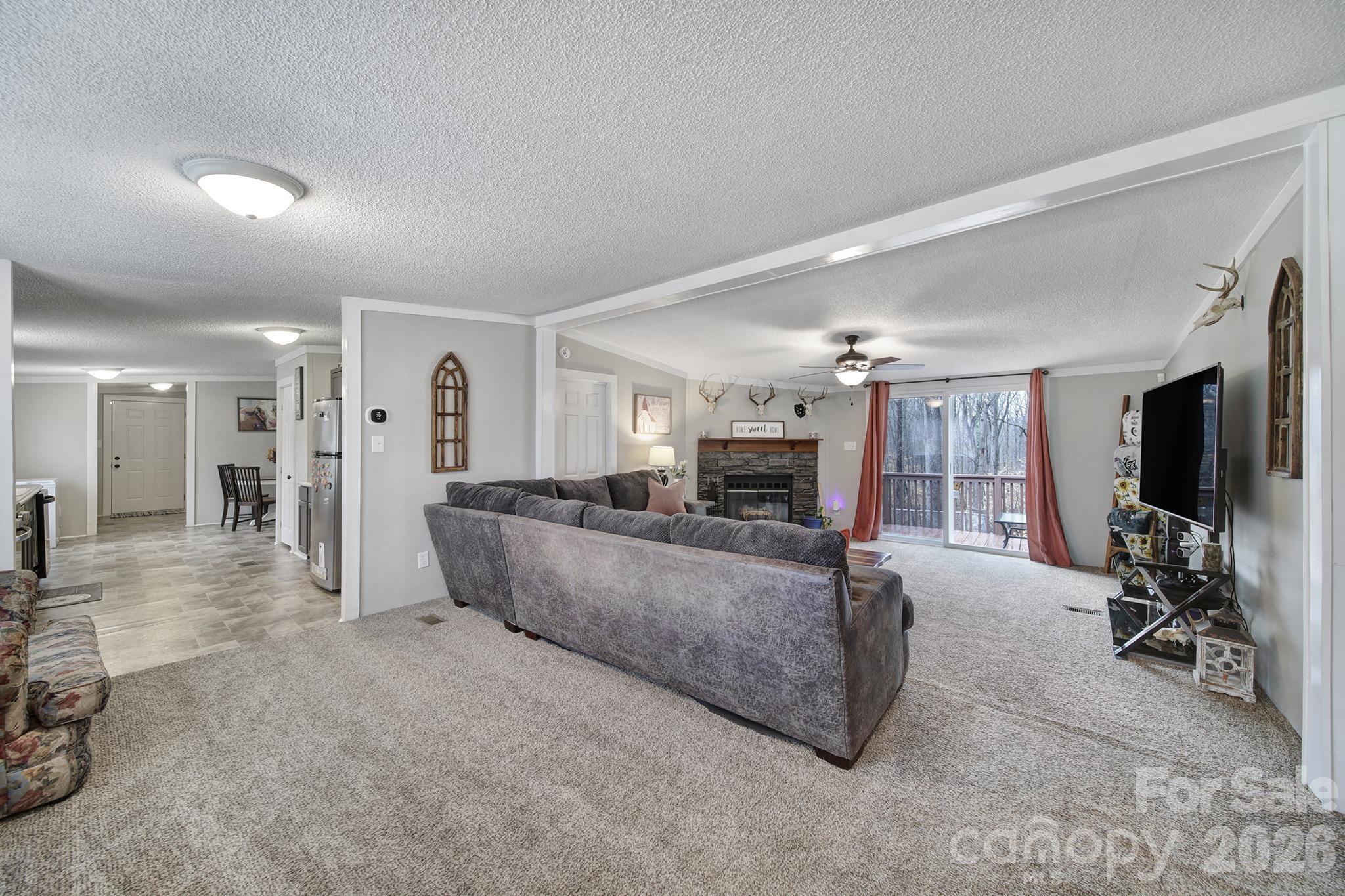 3840 Sherer Road Sharon, SC 29742 - Photo 3 of 30 a living room with furniture and a flat screen tv