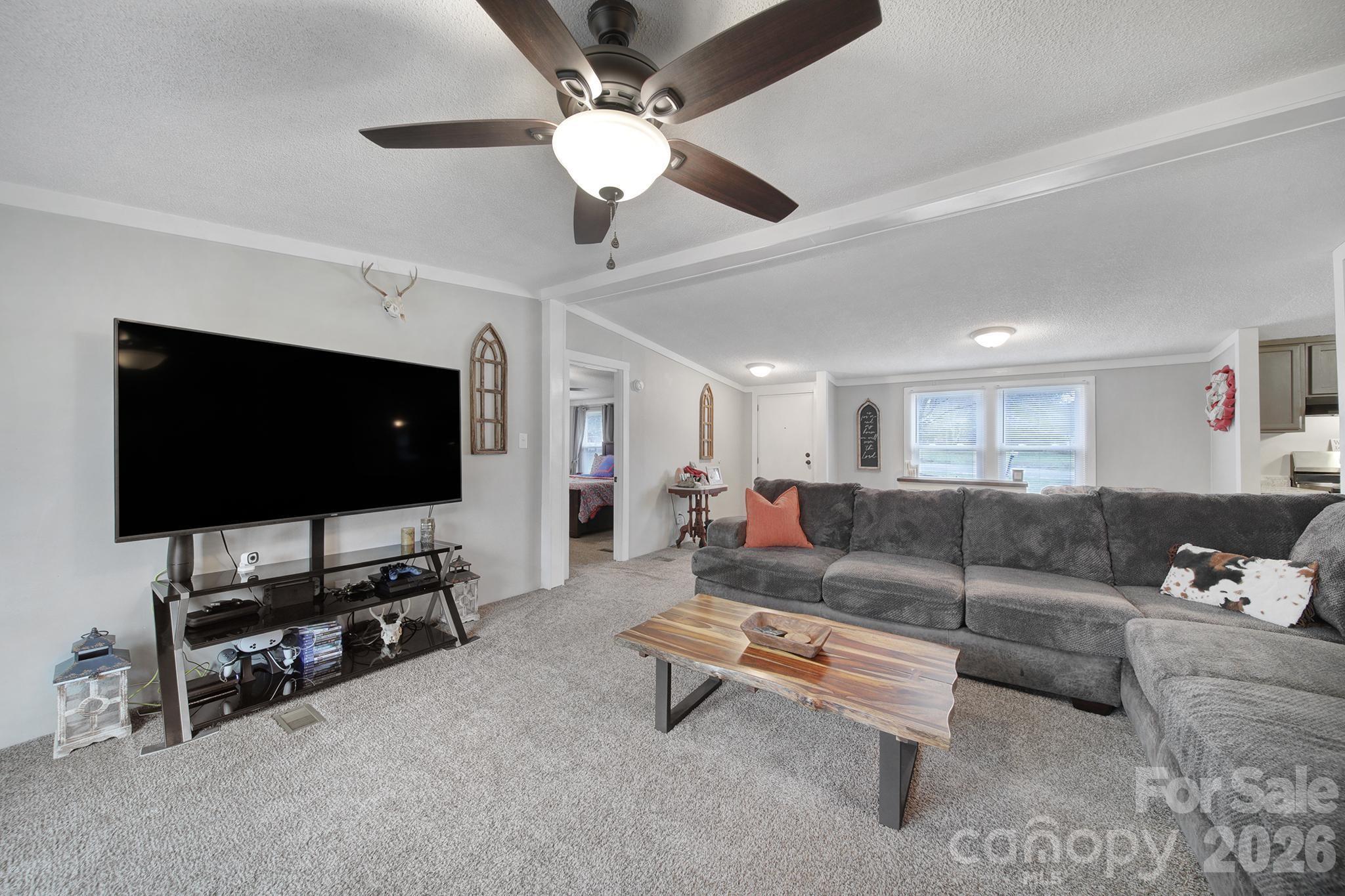 3840 Sherer Road Sharon, SC 29742 - Photo 5 of 30 a living room with furniture and a flat screen tv