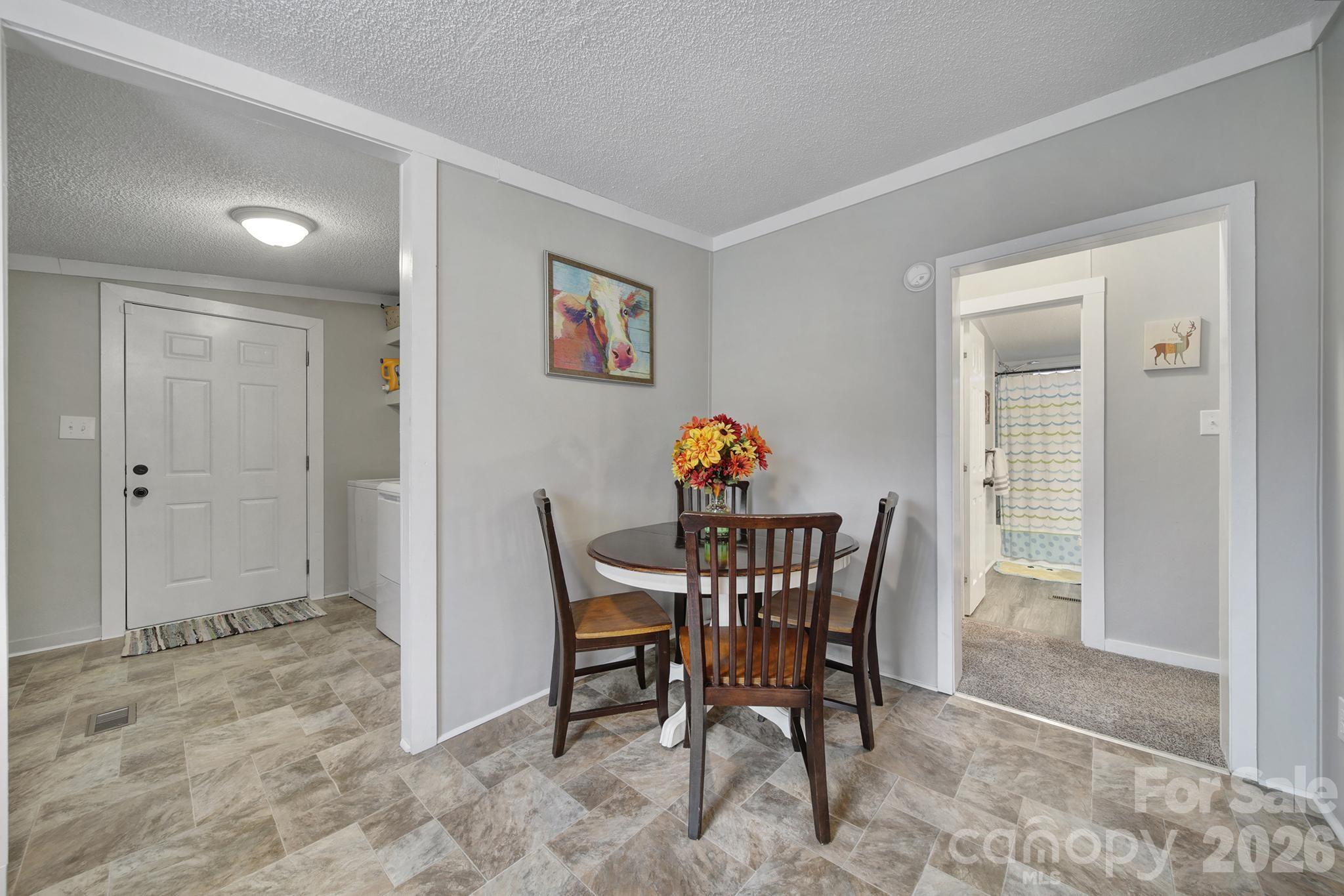 3840 Sherer Road Sharon, SC 29742 - Photo 8 of 30 a view of a dining room that has a table and a chair in it