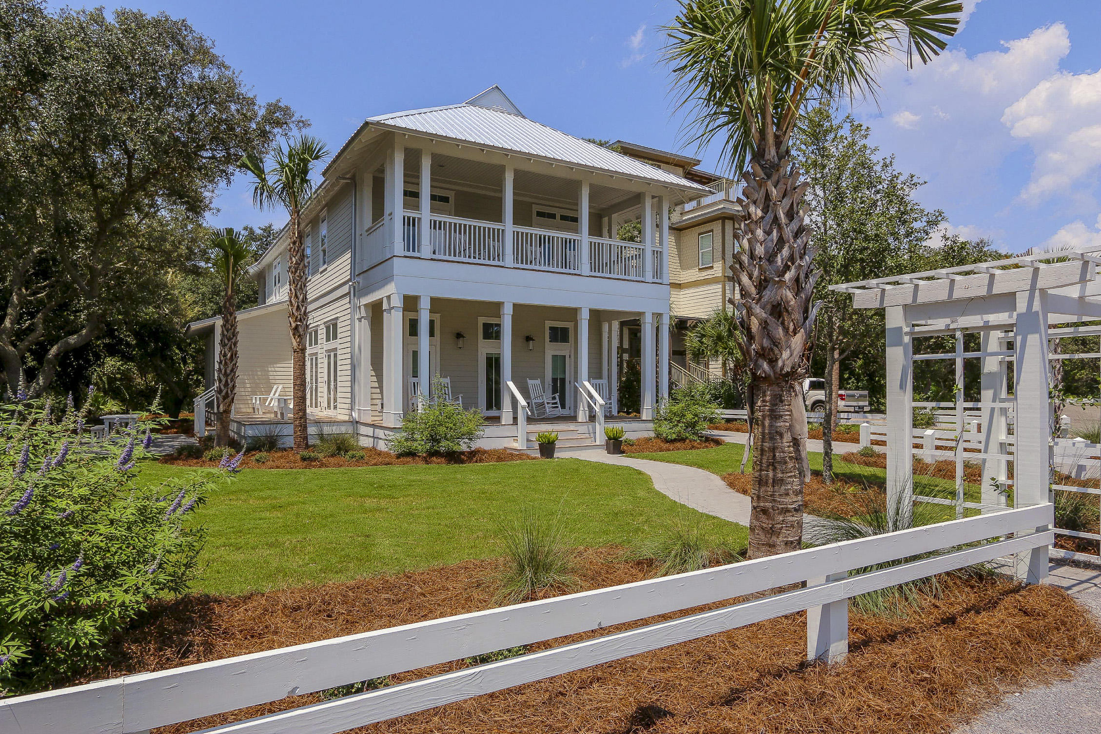 94 Blue Lake Road Santa Rosa Beach, FL 32459 - Photo 2 of 38 a front view of a house with garden