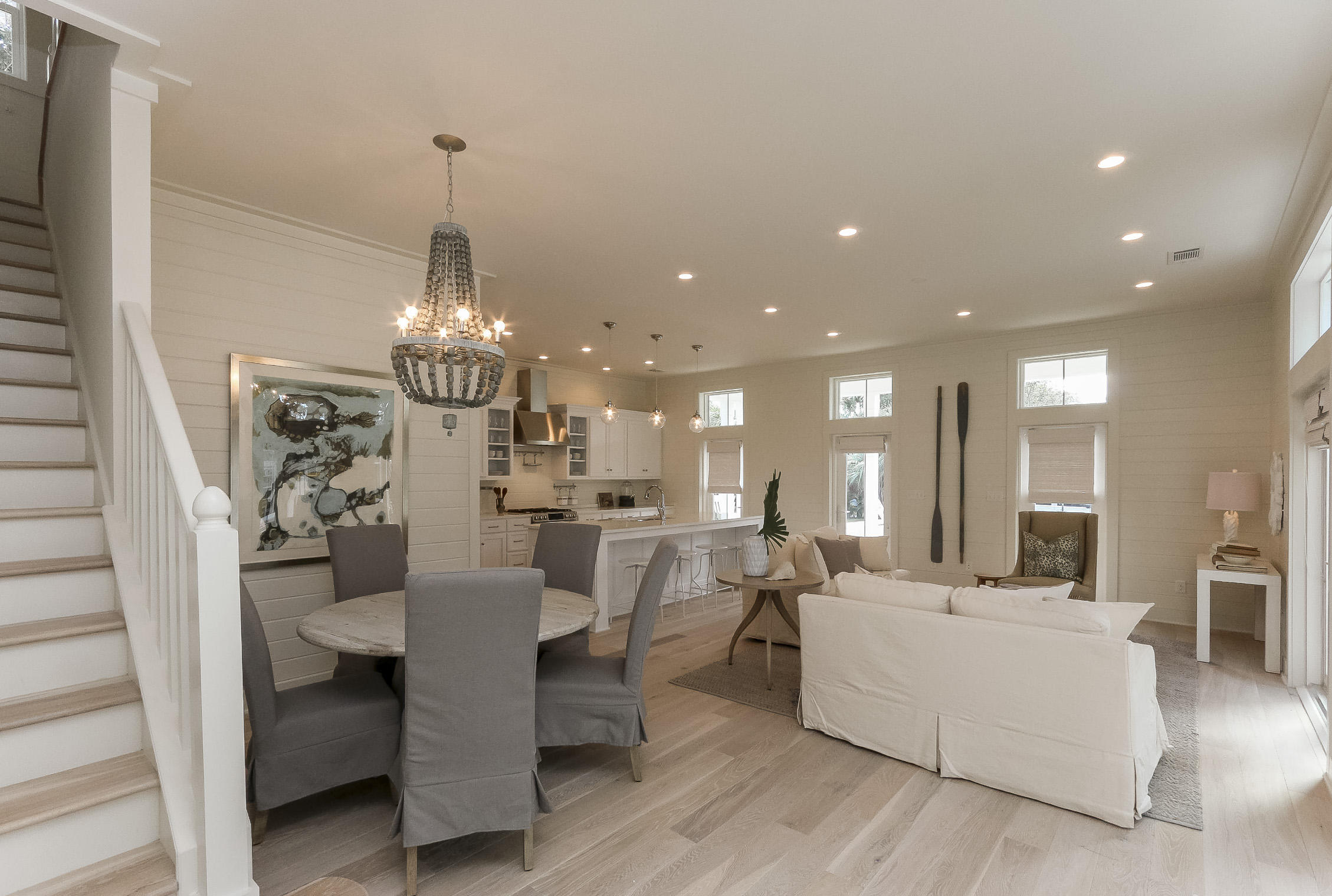 94 Blue Lake Road Santa Rosa Beach, FL 32459 - Photo 12 of 38 a large room with dining room chandelier and living room view