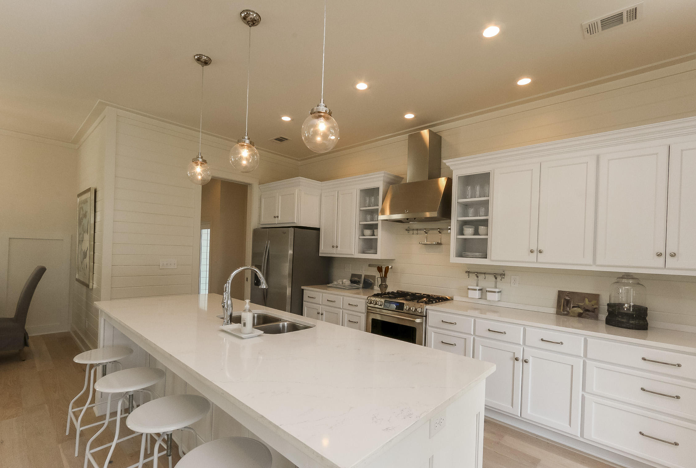 94 Blue Lake Road Santa Rosa Beach, FL 32459 - Photo 14 of 38 a kitchen with a sink stainless steel appliances and white cabinets