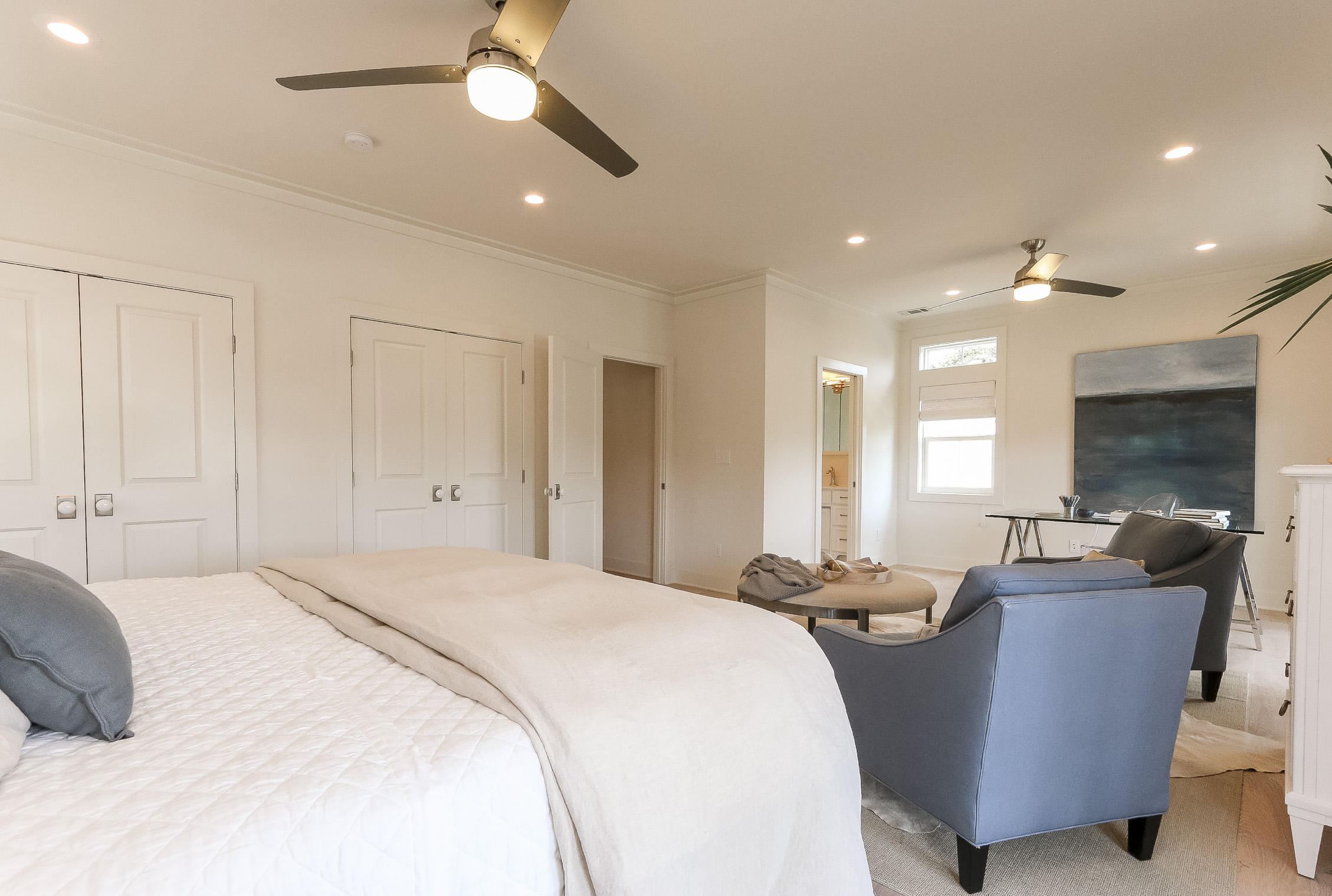 94 Blue Lake Road Santa Rosa Beach, FL 32459 - Photo 28 of 38 a large bedroom with a large bed a chandelier and closet