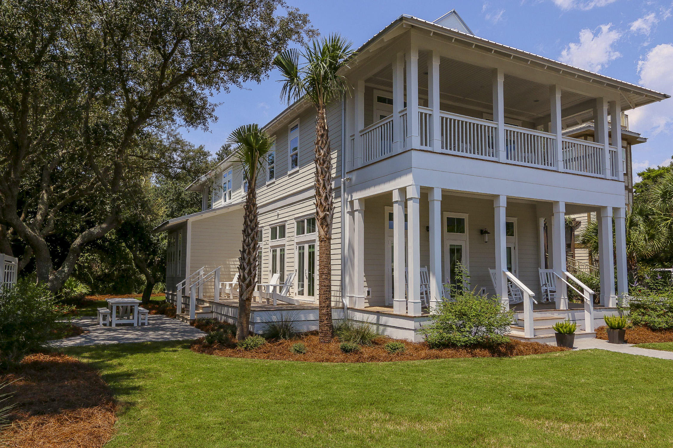 94 Blue Lake Road Santa Rosa Beach, FL 32459 - Photo 4 of 38 a front view of a house with a yard and porch