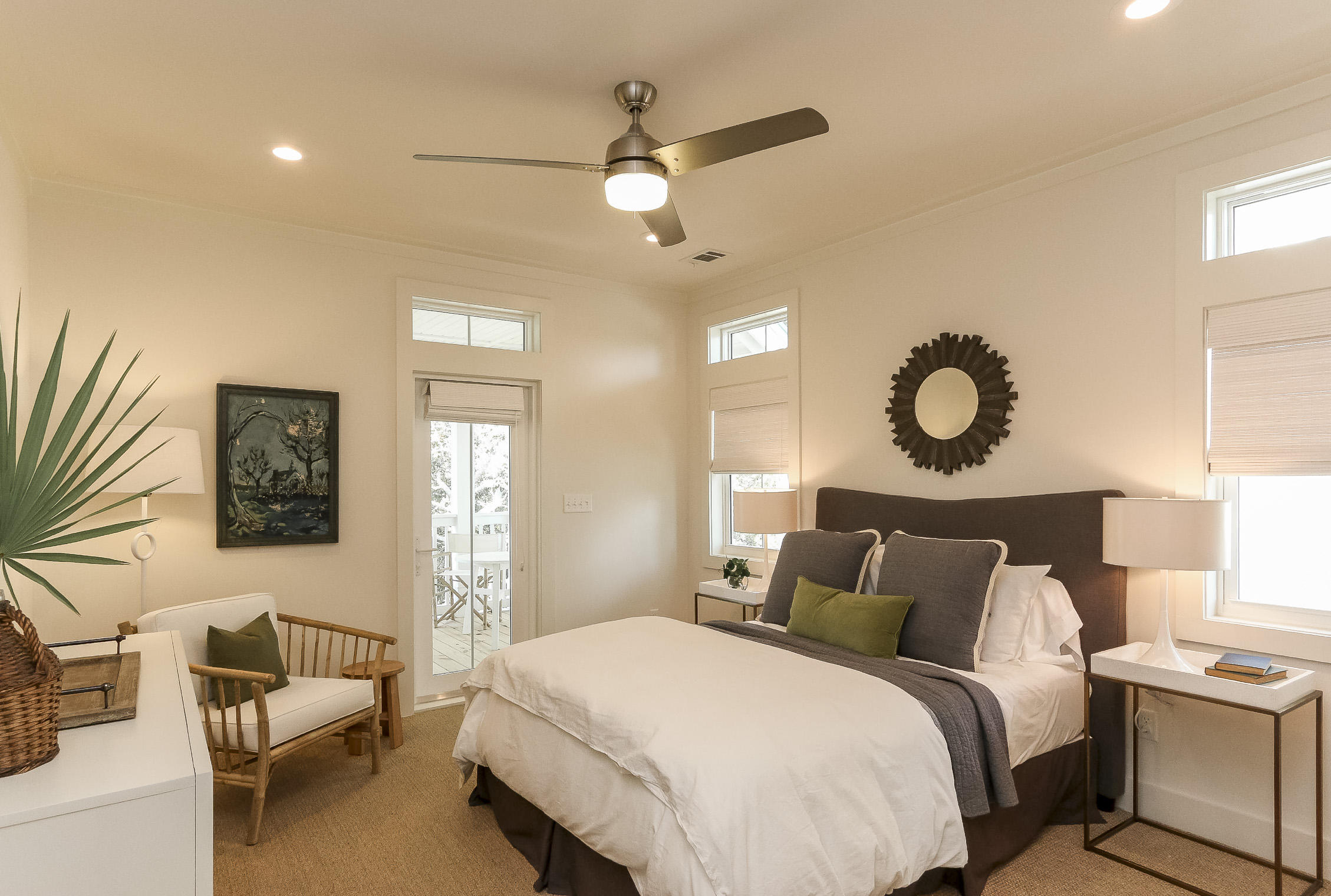 94 Blue Lake Road Santa Rosa Beach, FL 32459 - Photo 33 of 38 a bedroom with a bed and a chandelier