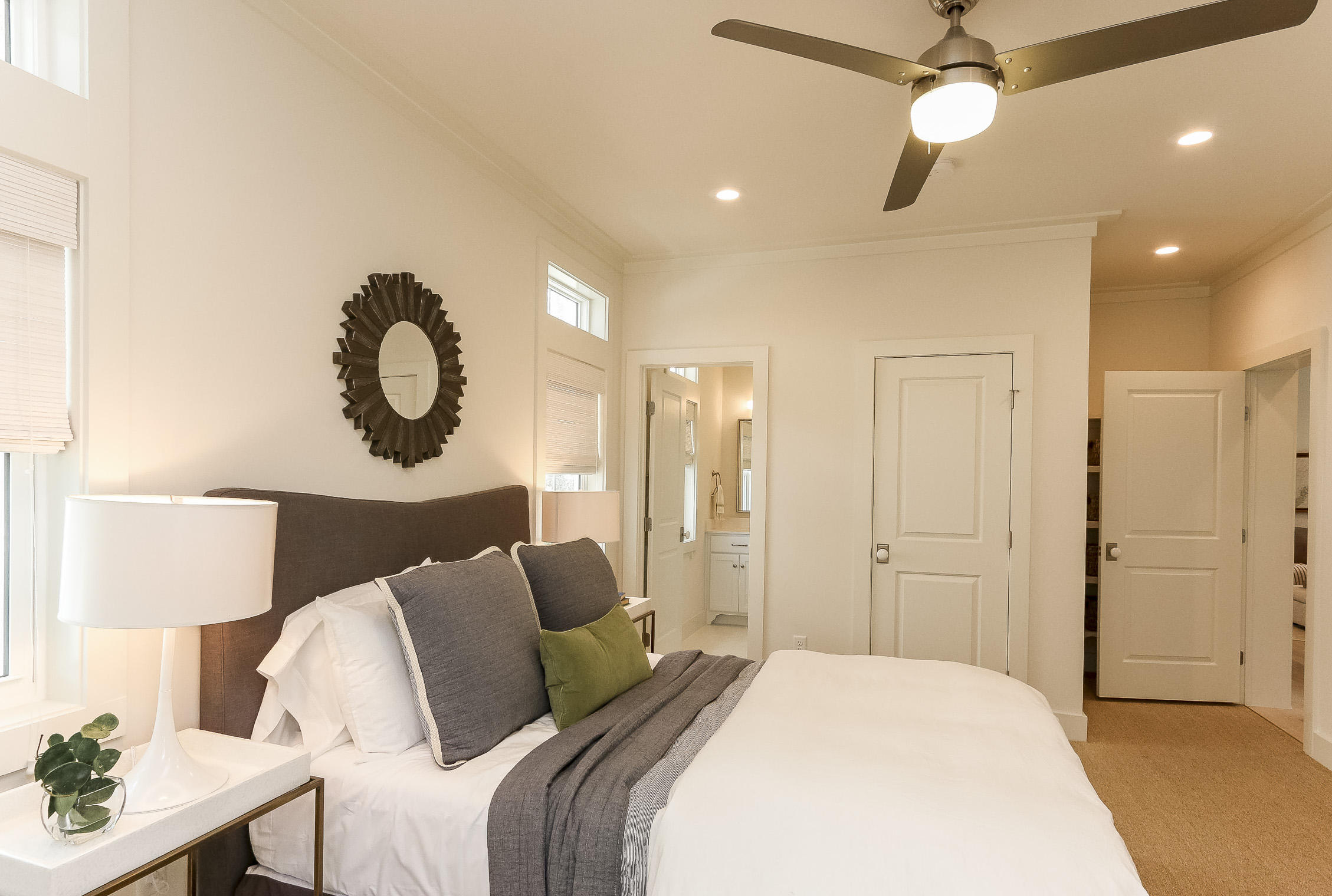 94 Blue Lake Road Santa Rosa Beach, FL 32459 - Photo 34 of 38 a spacious bedroom with a bed and a lamp