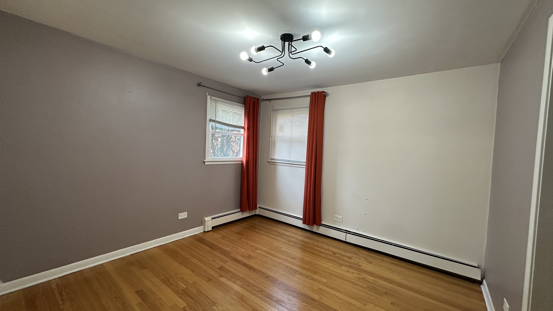 6118 West Gunnison Street, Unit 1 Chicago, IL 60630 - Photo 8 of 11 an empty room with windows