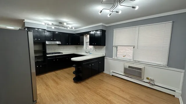 a kitchen with a sink and cabinets