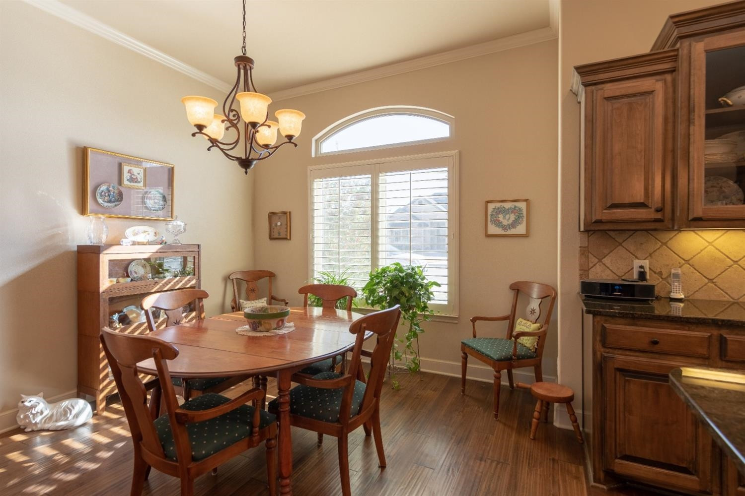 4110 124th Street Lubbock, TX 79423 - Photo 12 of 32 a view of a dining room with furniture window and wooden floor