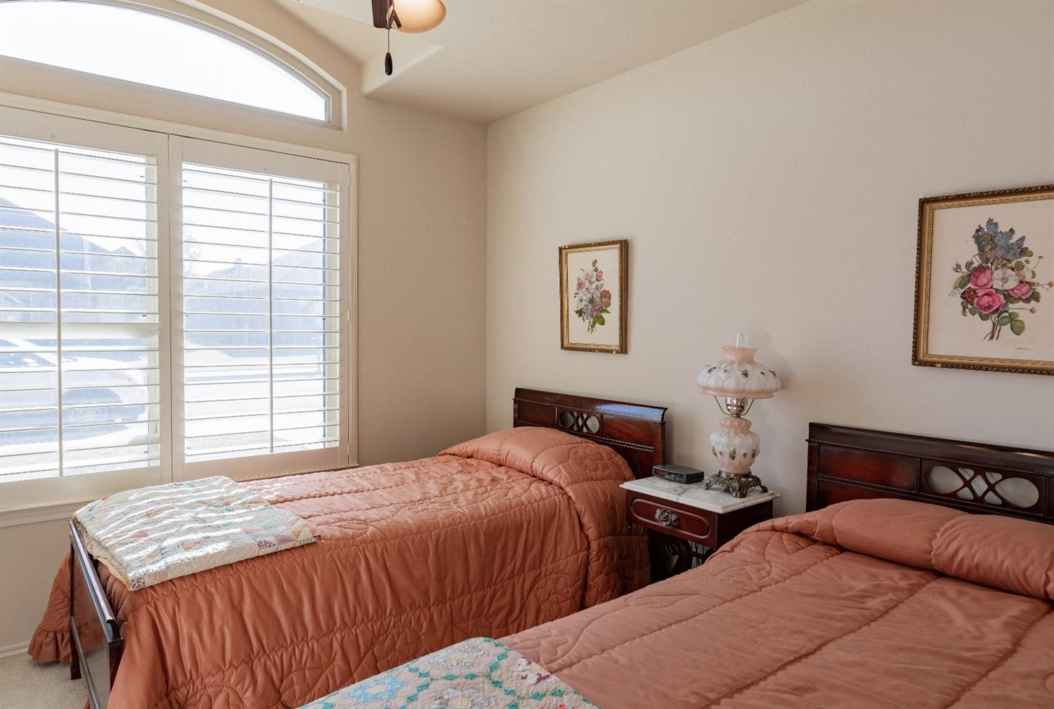 4110 124th Street Lubbock, TX 79423 - Photo 22 of 32 a bedroom with two beds and a large window