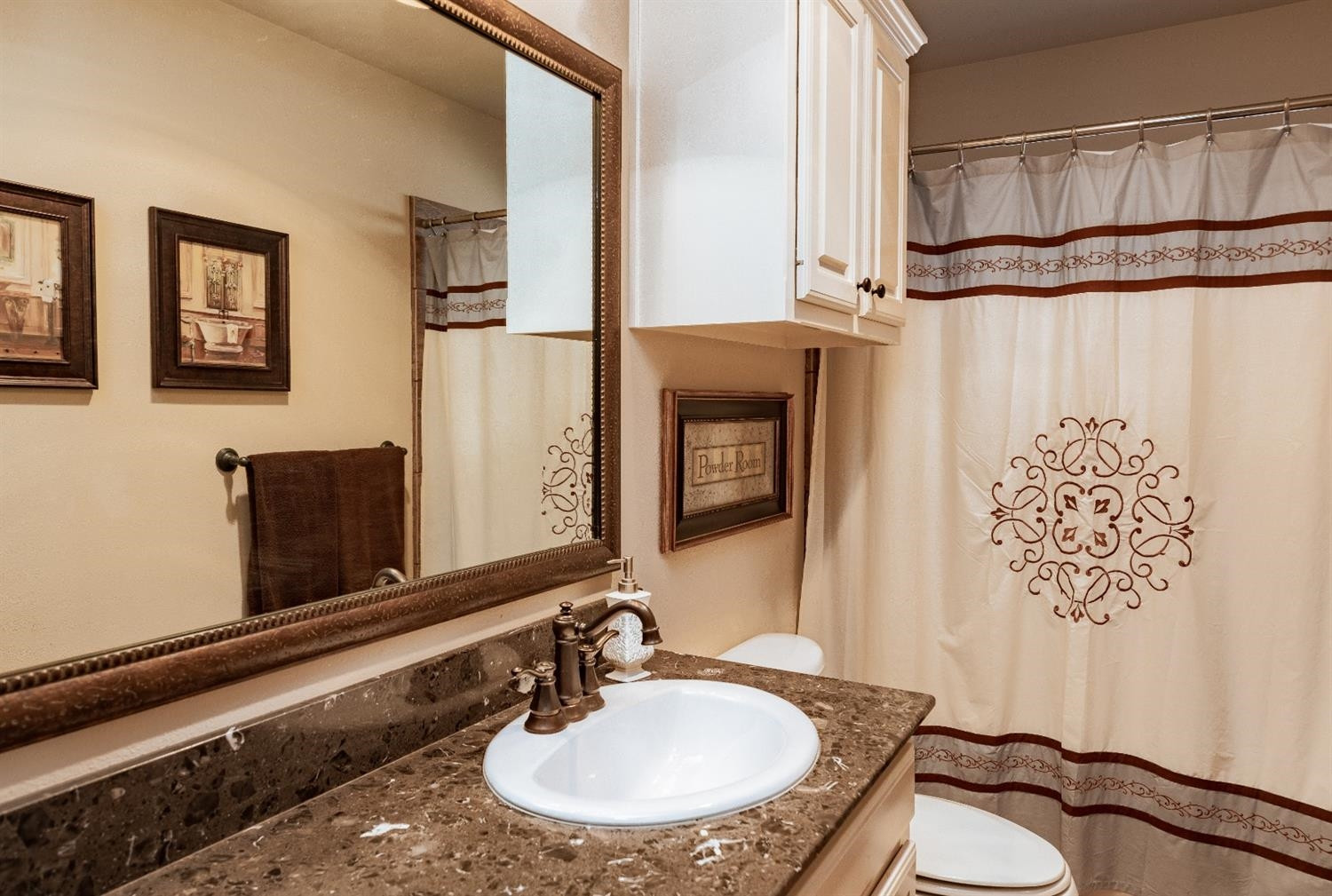4110 124th Street Lubbock, TX 79423 - Photo 24 of 32 a bathroom with a sink and a mirror