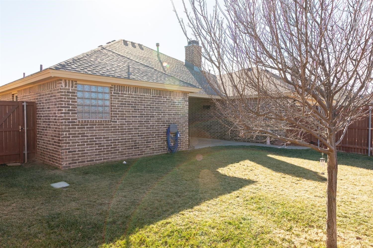 4110 124th Street Lubbock, TX 79423 - Photo 28 of 32 a view of a house with a yard