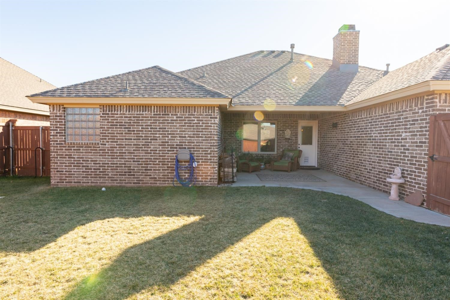 4110 124th Street Lubbock, TX 79423 - Photo 29 of 32 a view of a house with a yard and sitting area