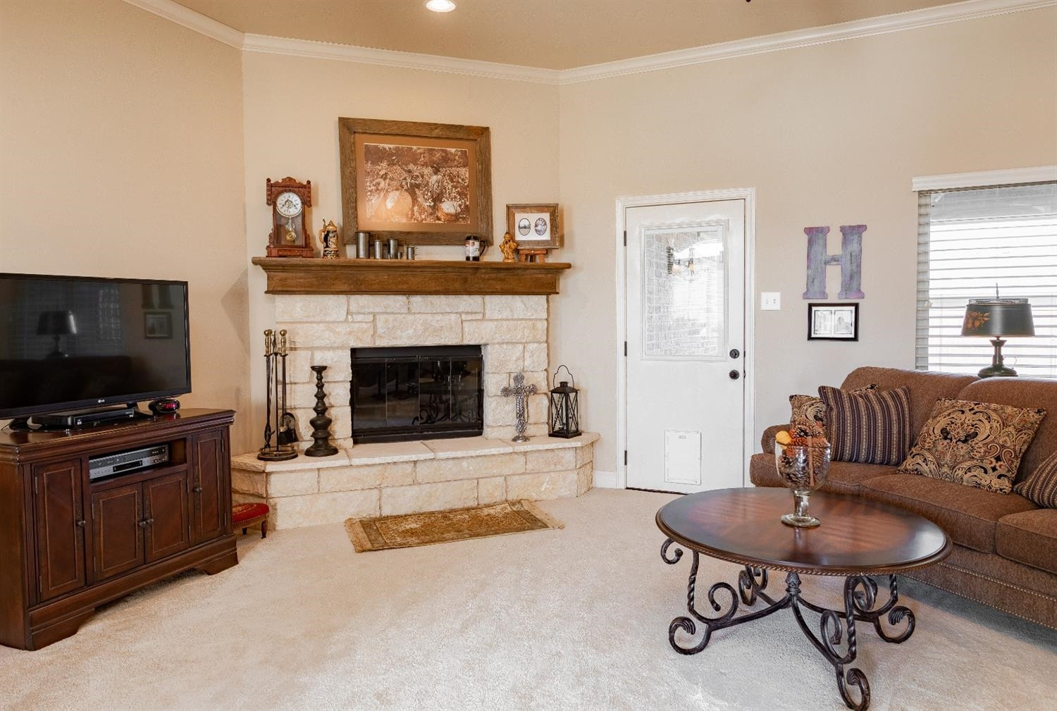 4110 124th Street Lubbock, TX 79423 - Photo 3 of 32 a living room with furniture and a fireplace