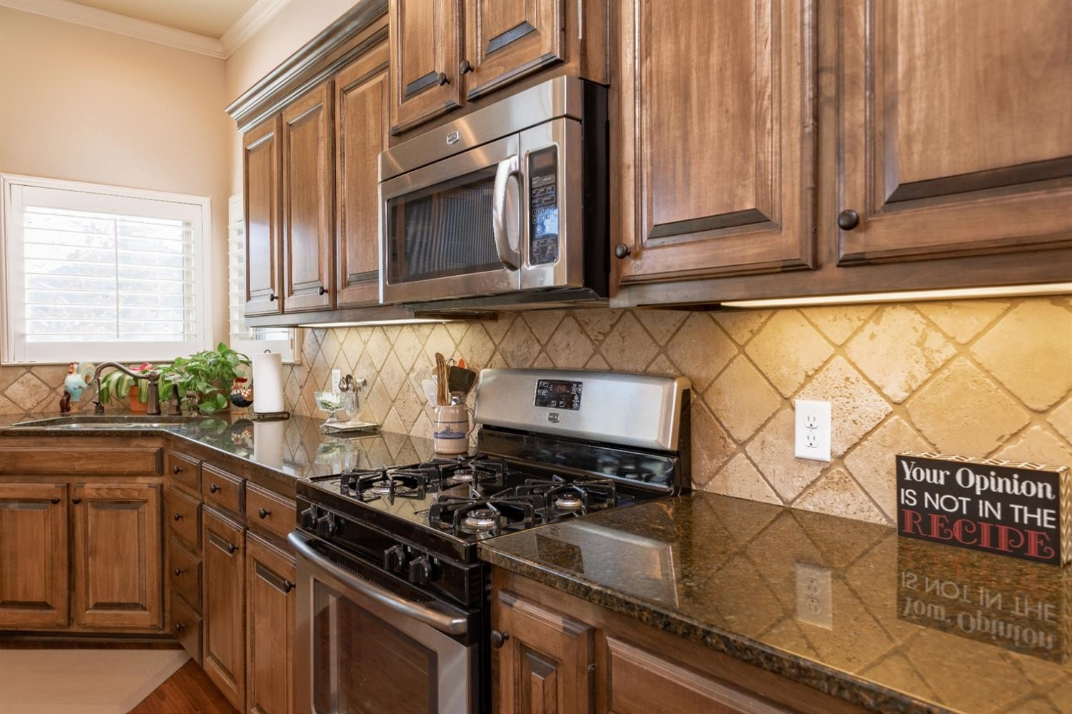 4110 124th Street Lubbock, TX 79423 - Photo 7 of 32 a kitchen with a stove and a microwave