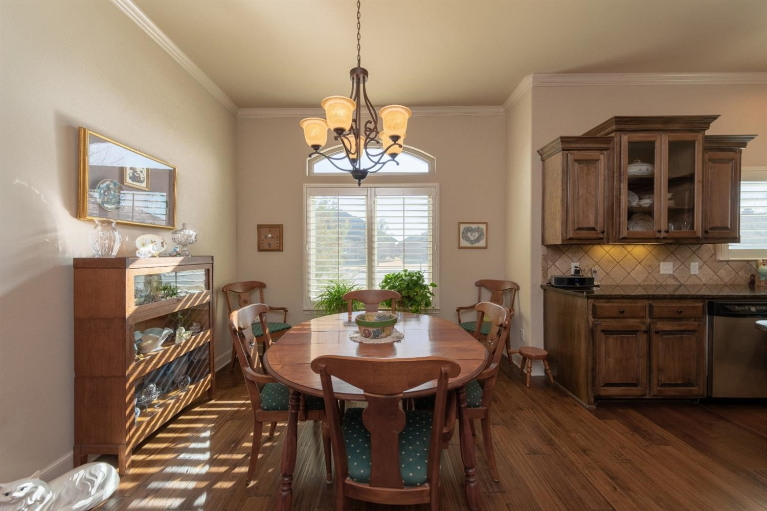 4110 124th Street Lubbock, TX 79423 - Photo 10 of 32 a view of a dining room with furniture window and wooden floor
