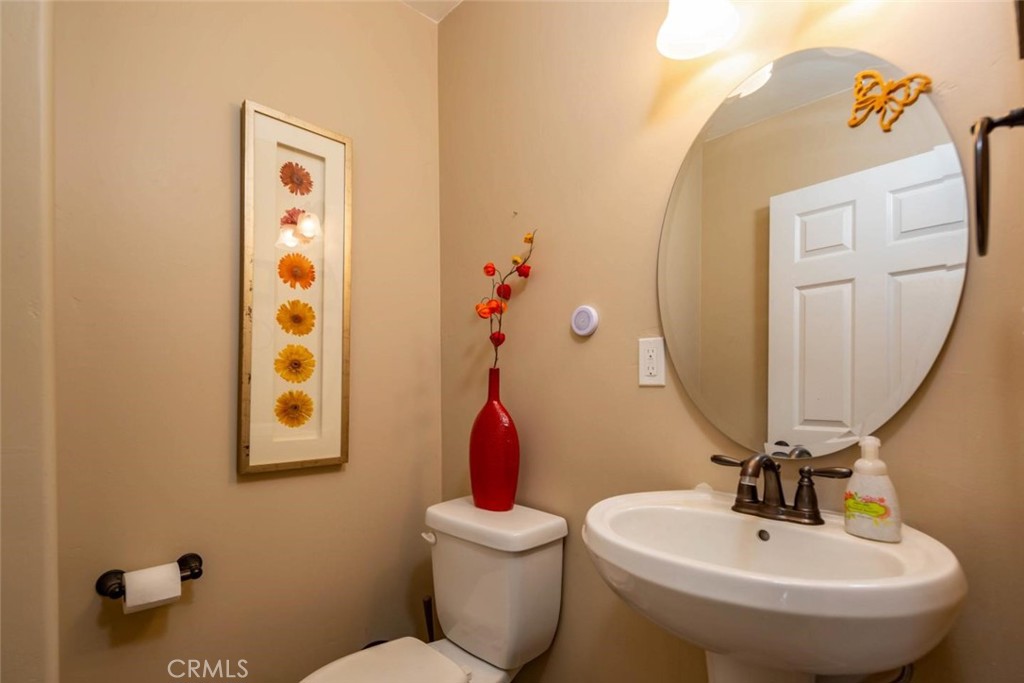 2138 Wilton Drive Cambria, CA 93428 - Photo 13 of 37 a bathroom with a toilet sink and mirror