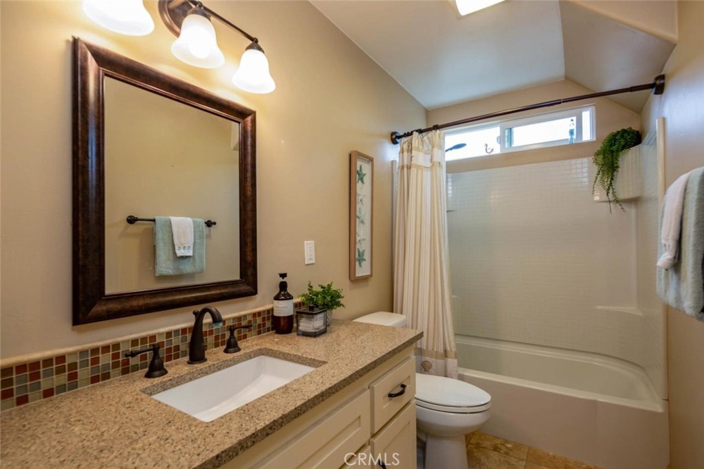 2138 Wilton Drive Cambria, CA 93428 - Photo 21 of 37 a bathroom with a granite countertop sink toilet and shower