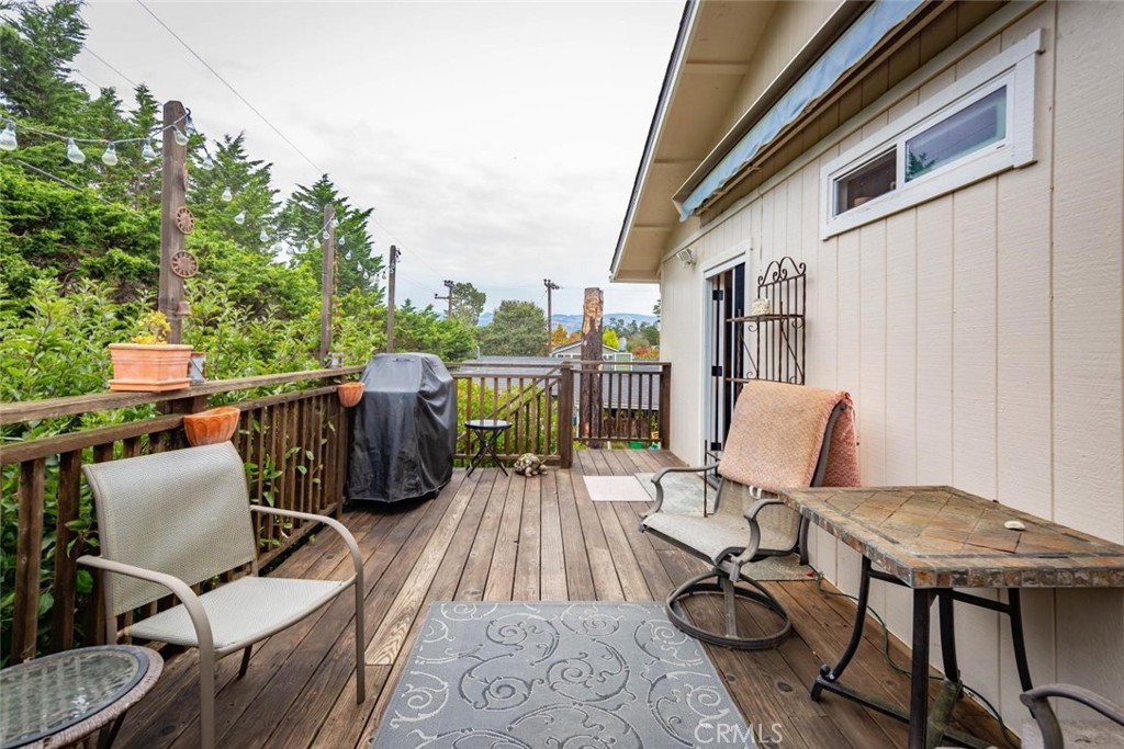 2138 Wilton Drive Cambria, CA 93428 - Photo 32 of 37 a view of a patio with table and chairs
