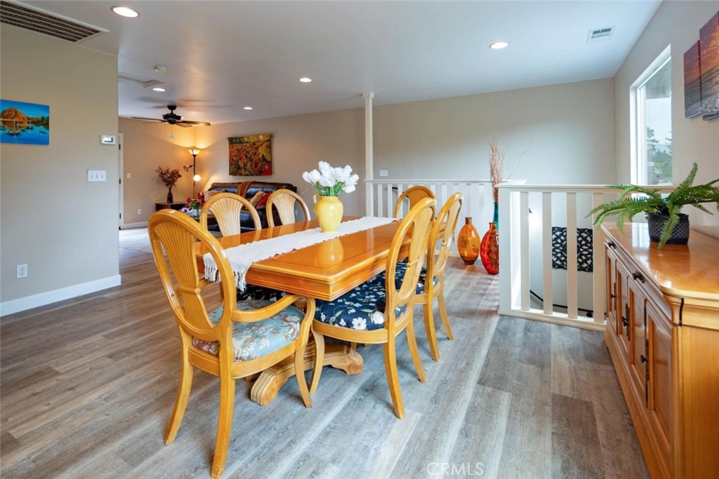 2138 Wilton Drive Cambria, CA 93428 - Photo 10 of 37 a view of a dining room with furniture and wooden floor