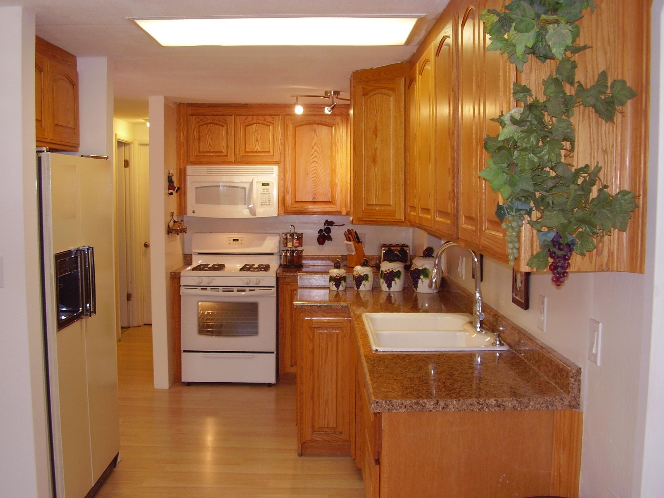 12062 Daut Road Redding, CA 96003 - Photo 8 of 26 a kitchen with stainless steel appliances granite countertop a stove a sink and a refrigerator