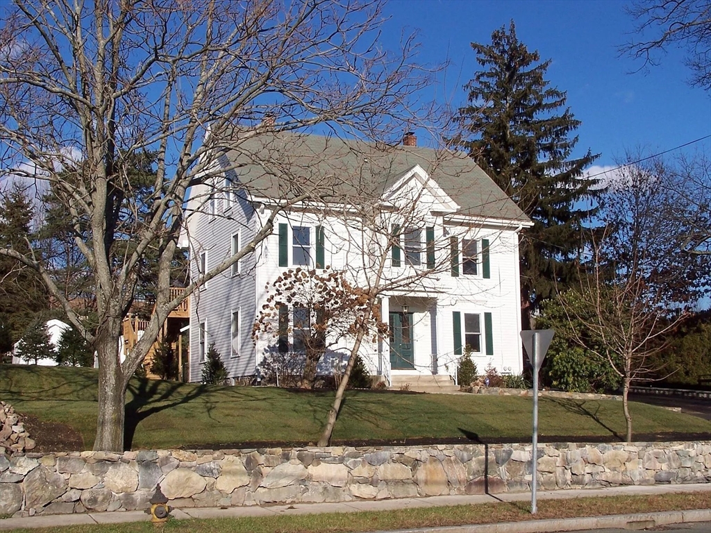 19 Stow Street, Unit 2 Waltham, MA 02453 - Photo 1 of 1 a view of a white house with a yard