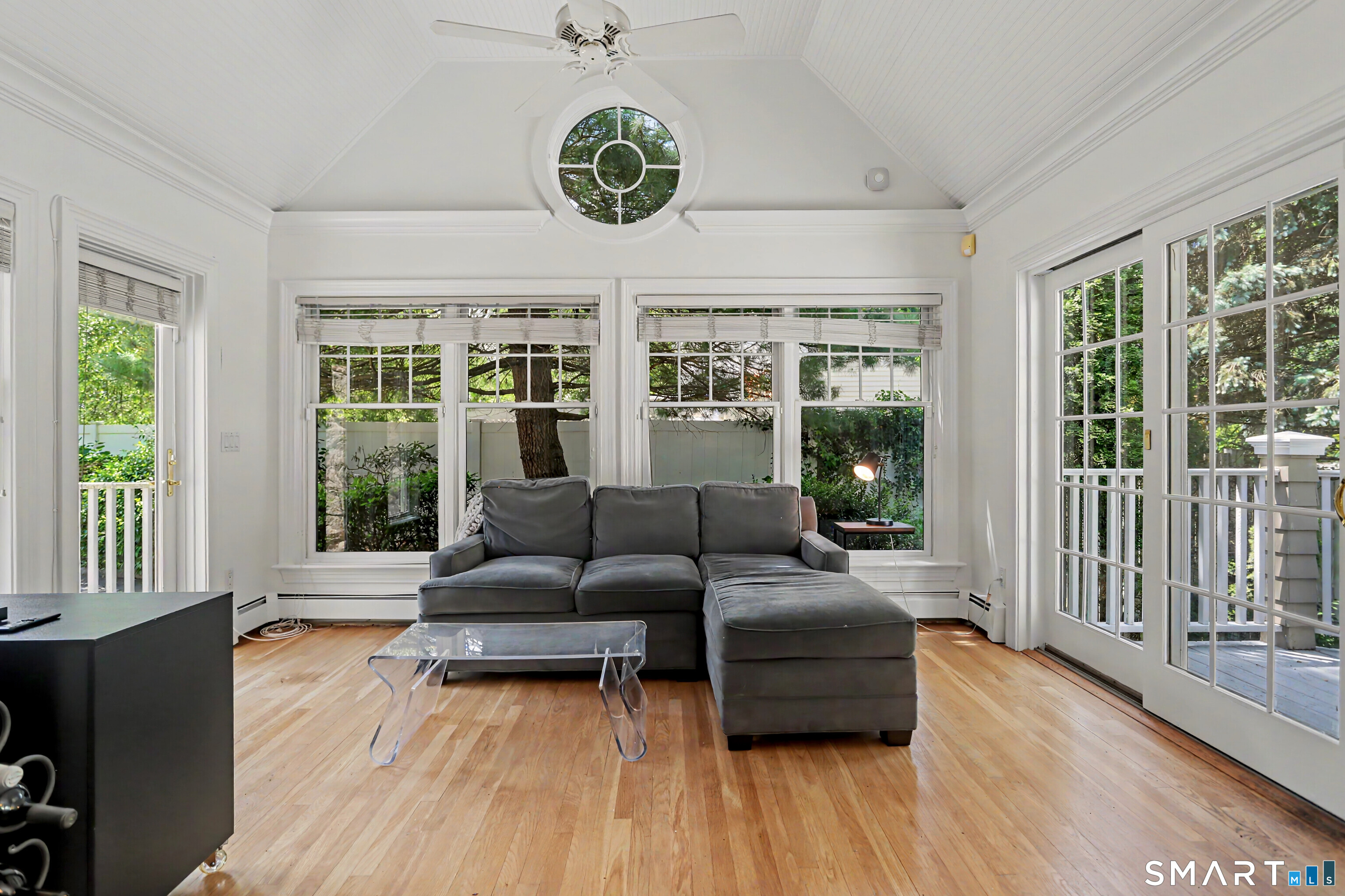 186 Compo Road South Westport, CT 06880 - Photo 14 of 40 Enjoy the vaulted ceiling, the door to the spacious deck and sunny interior