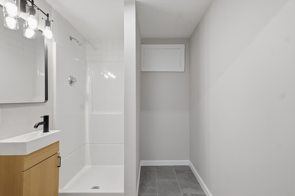 105 Stafford Road Lowell, MA 01852 - Photo 28 of 42 a bathroom with a sink and a mirror