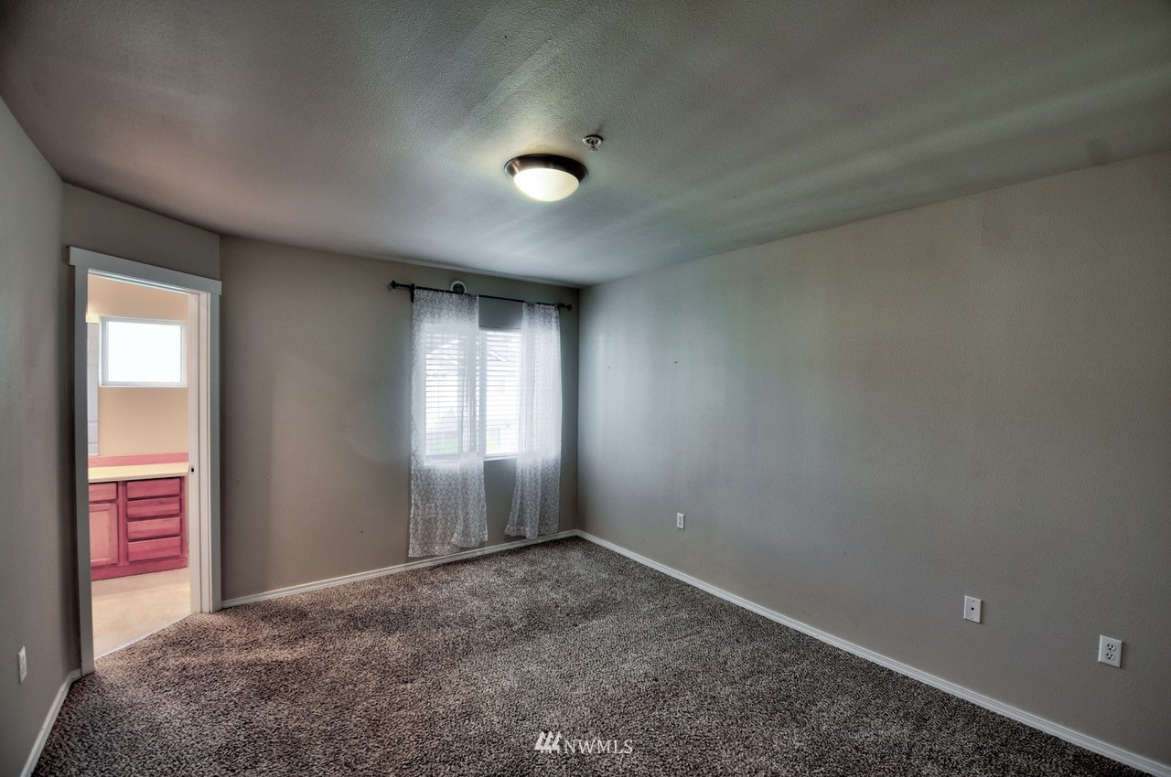 5305 Military Road East, Unit G Tacoma, WA 98446 - Photo 13 of 22 an empty room with windows