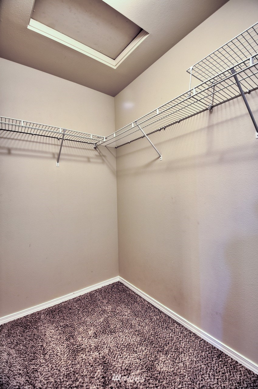 5305 Military Road East, Unit G Tacoma, WA 98446 - Photo 16 of 22 a view of a room with racks on the wall
