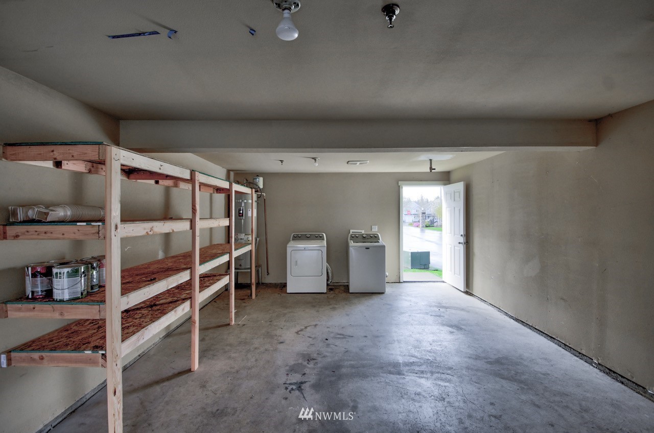 5305 Military Road East, Unit G Tacoma, WA 98446 - Photo 19 of 22 a view of an empty room with shelves