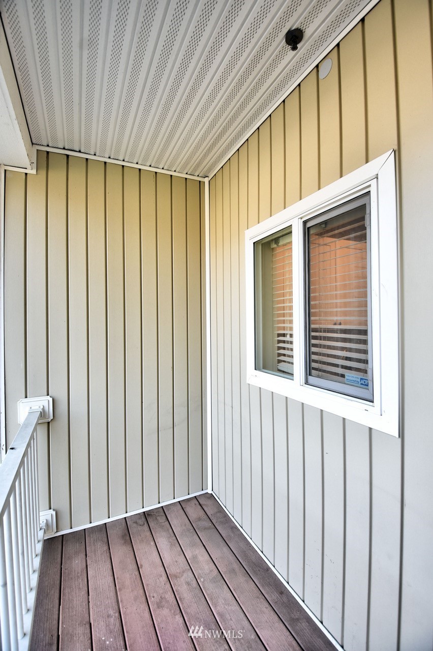5305 Military Road East, Unit G Tacoma, WA 98446 - Photo 21 of 22 a view of wooden balcony
