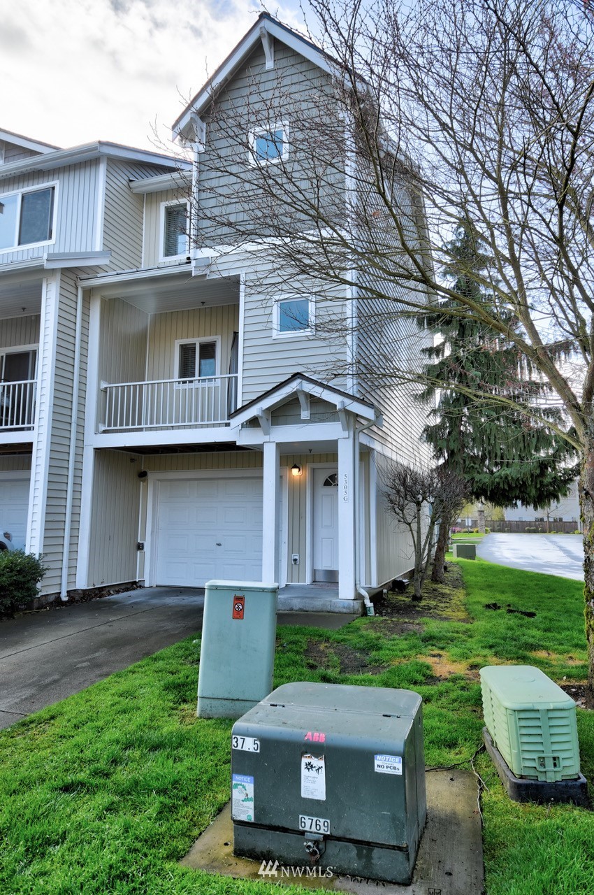 5305 Military Road East, Unit G Tacoma, WA 98446 - Photo 22 of 22 a front view of a house with garden