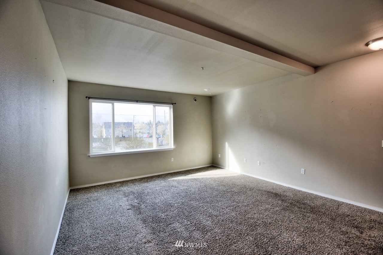 5305 Military Road East, Unit G Tacoma, WA 98446 - Photo 7 of 22 a view of an empty room with a window