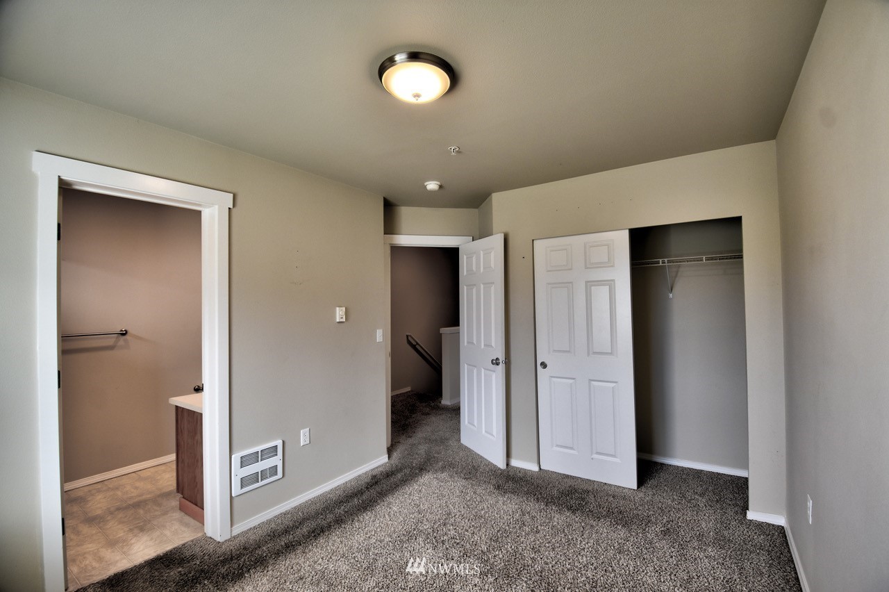 5305 Military Road East, Unit G Tacoma, WA 98446 - Photo 9 of 22 a view of a hallway with closet area