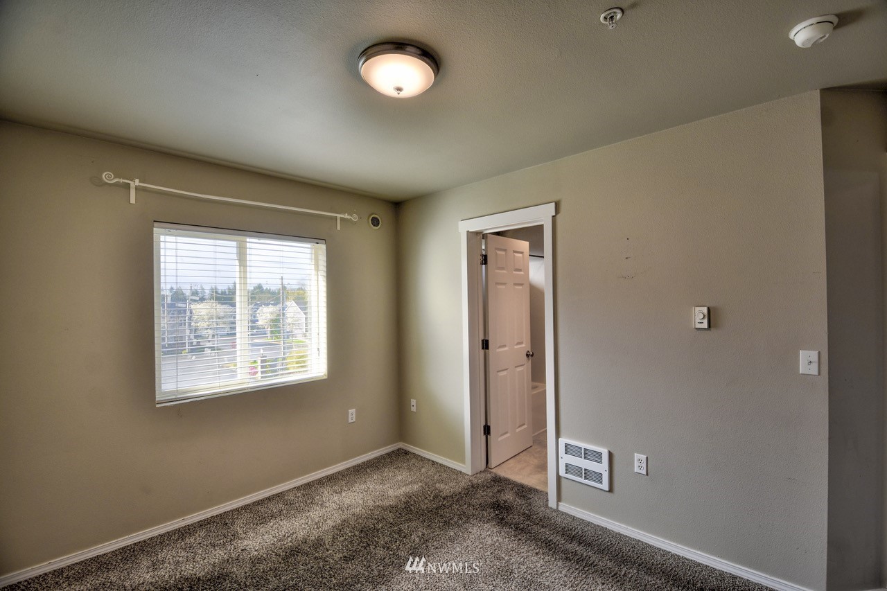 5305 Military Road East, Unit G Tacoma, WA 98446 - Photo 10 of 22 an empty room with windows